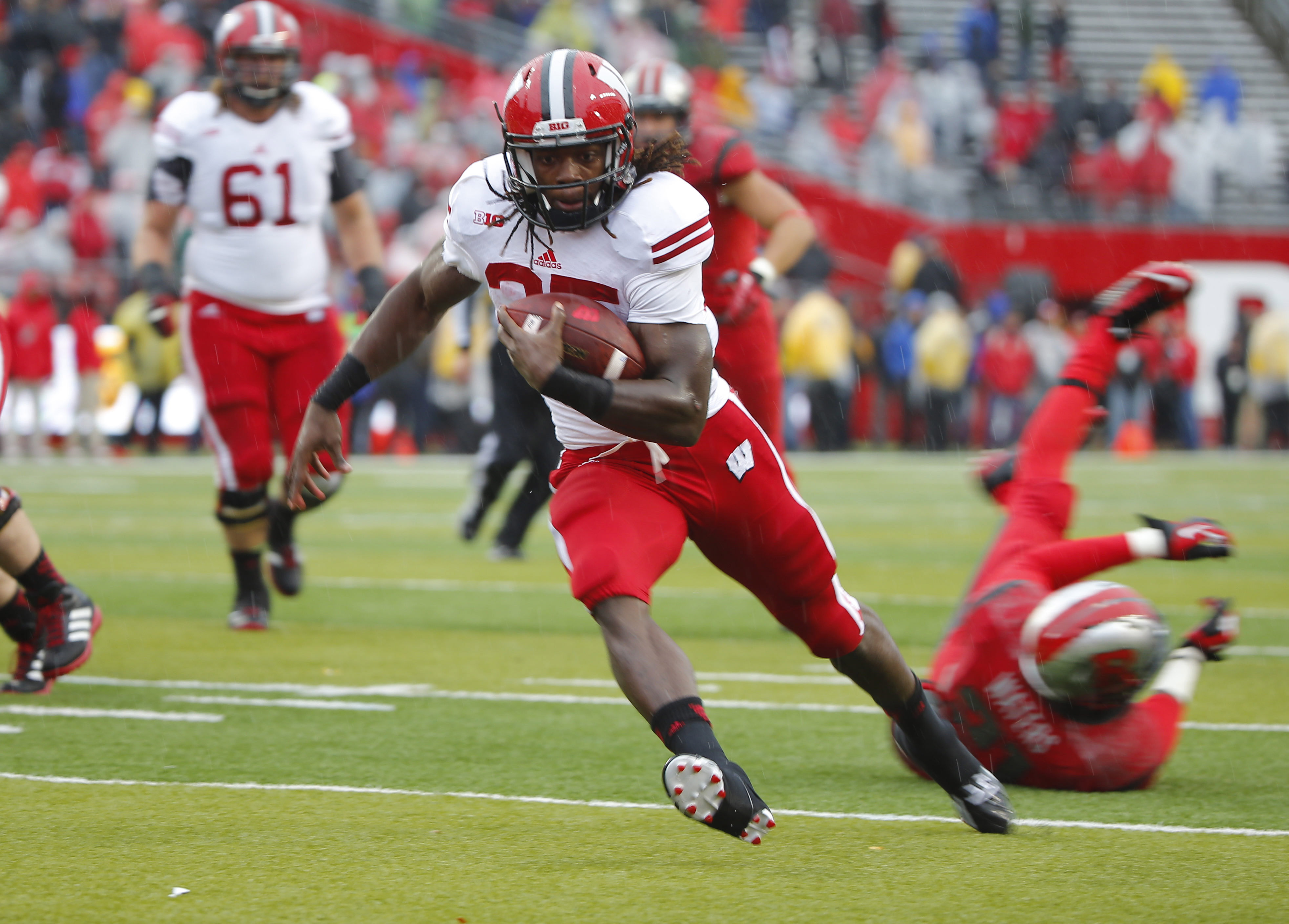 Nov 1, 2014; Piscataway, NJ, USA; Wisconsin Badgers running back Melvin Gordon (25) scores touchdown during the first quarter against the Rutgers Scarlet Knights at High Points Solutions Stadium. Mandatory Credit: Jim O'Connor-USA TODAY Sports